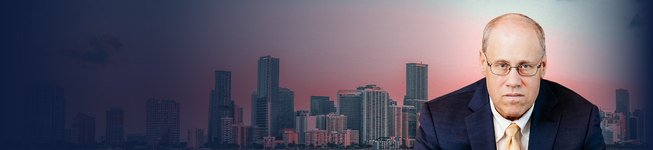 Erik Scharf with the Miami skyline in the background